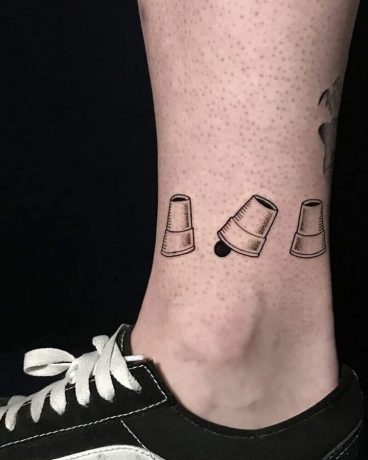 Fine Line Cup&Ball tattoo in leg