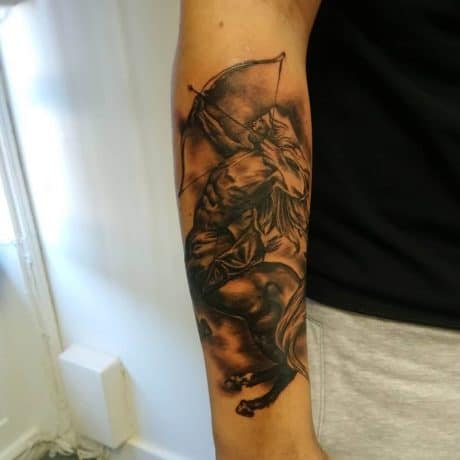 Black & Grey Style Saggitarius tattoo in arm