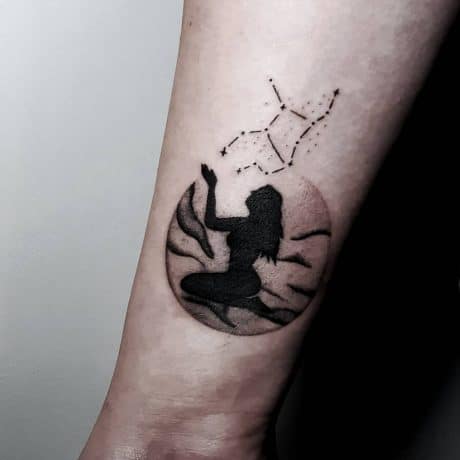 Blackwork Style Virgo tattoo in arm