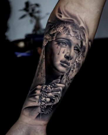 Stone Work Style of a woman Praying tattoo in arm