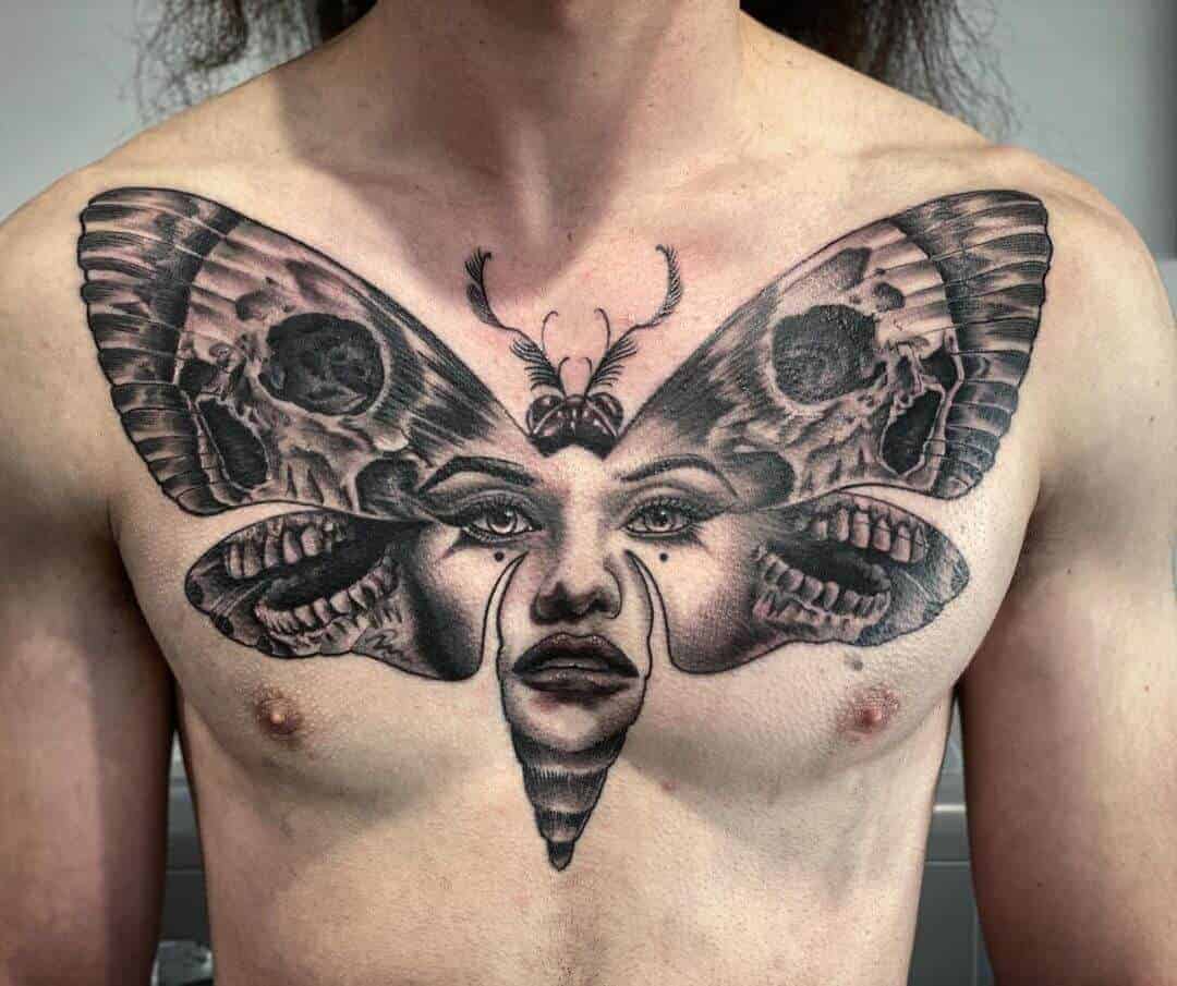 Death Moth tattoo in chest by Vaughn Odendaal