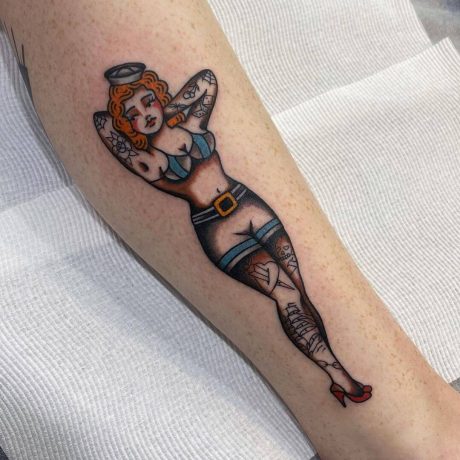 Pin-up girl tattoo in leg