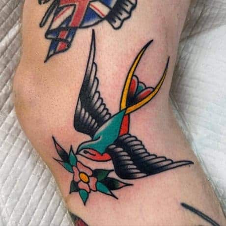 Traditional Swallow tattoo in leg