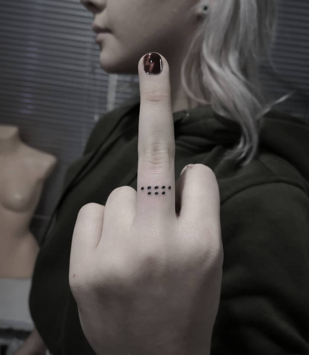 Dot ring on Mid Finger tattoo