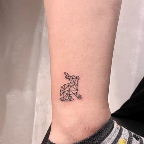 Rabbit linework geo tattoo on ankle