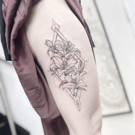 Geometric Flower tattoo on thigh
