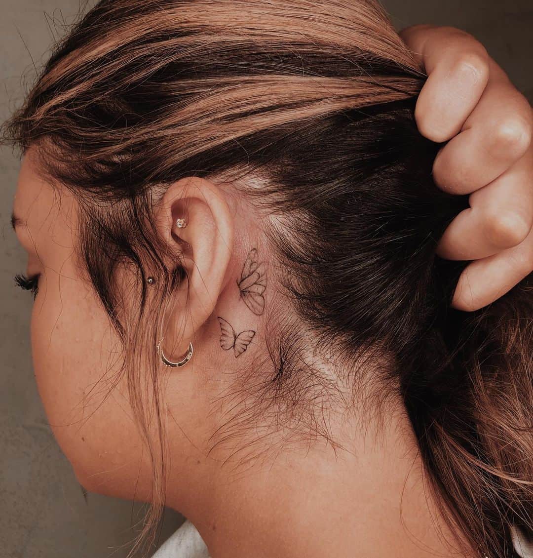 Butterfly tattoo behind ear