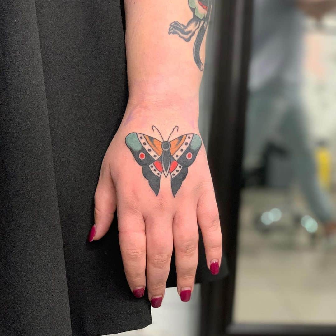 Butterfly tattoo on hand