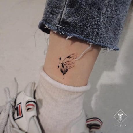 Cute Semi colon butterfly tattoo on leg