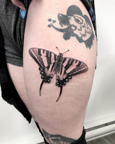 butterfly tattoo on thigh