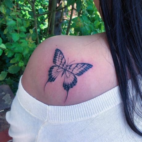 black butterfly tattoo on shoulder back