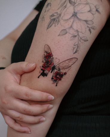 butterfly tattoo with rose by artist yeonji heart