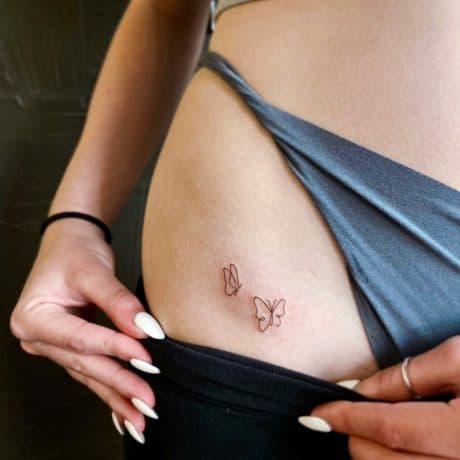 tiny line butterfly tattoo