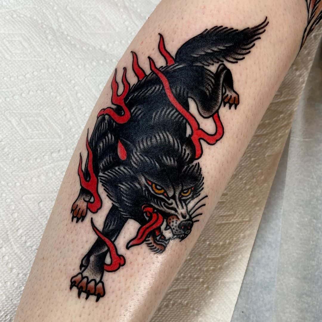 angelhandstattoo traditional wolf tattoo on forearm