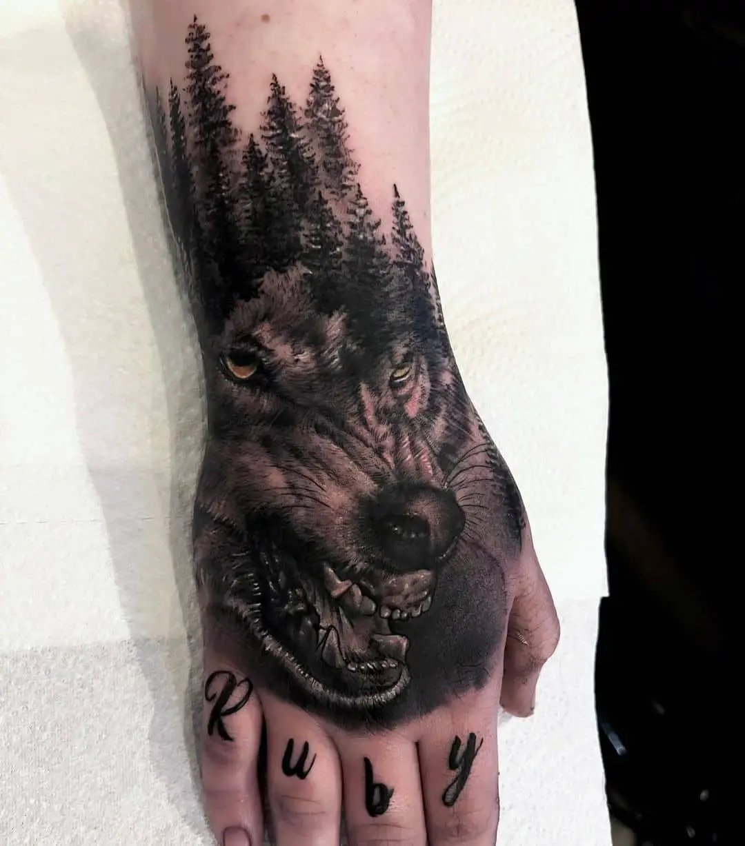 black wolf tattoo on hand by benspittletattoos