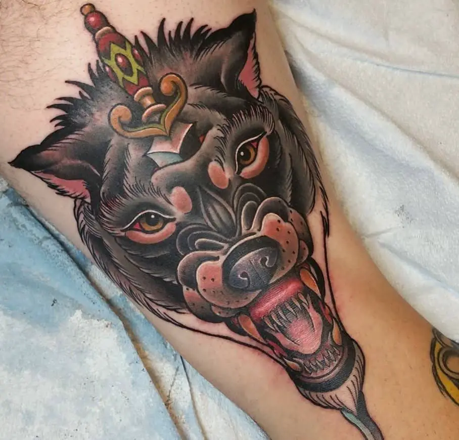 derekzielinski wolf face and dragger tattoo