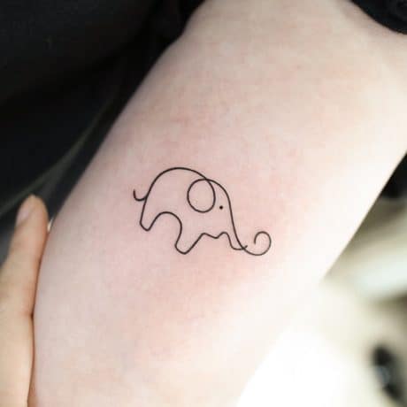 small elephant tattoo on sleeve