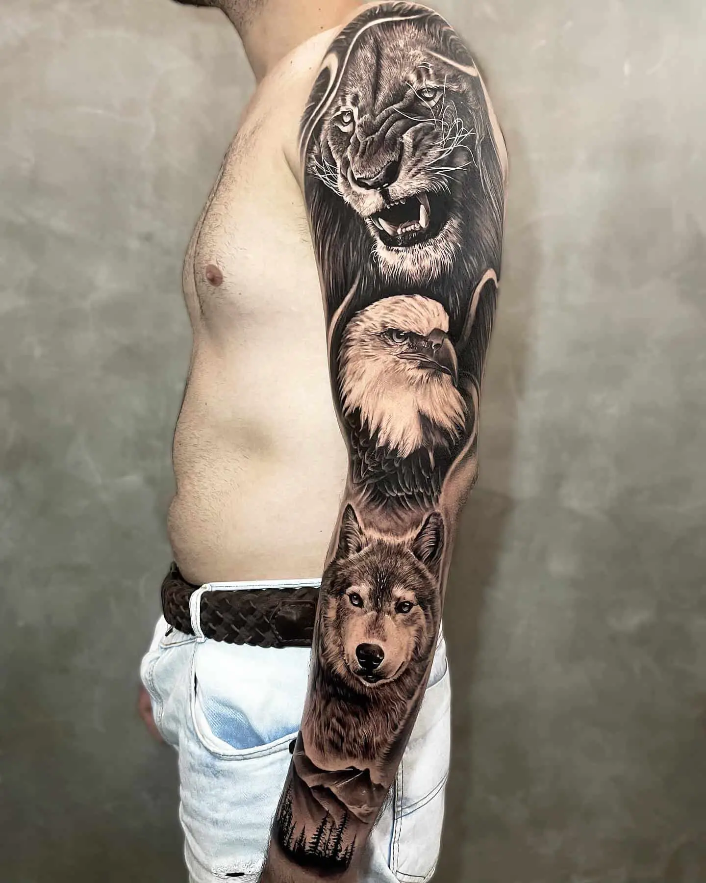 lion and wolf tattoo in arms