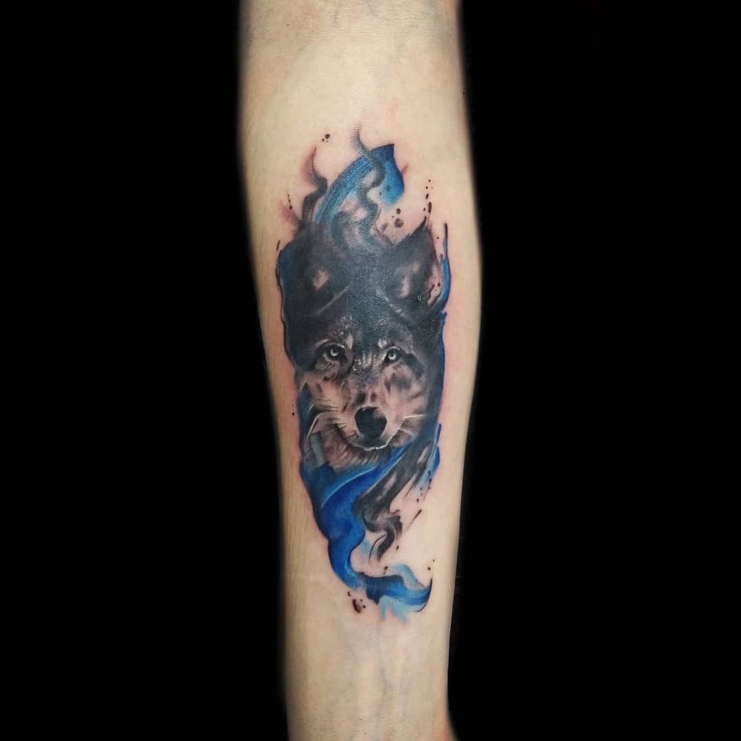 jinxedmike water color wolf tattoo on forearm