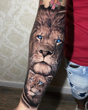 lion and lioness tattoo on forearm