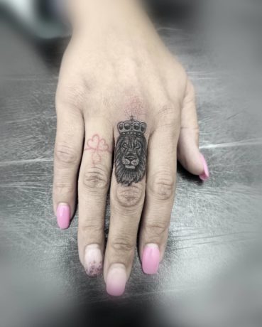 lion finger tattoo