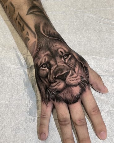 lion head tattoo on hand
