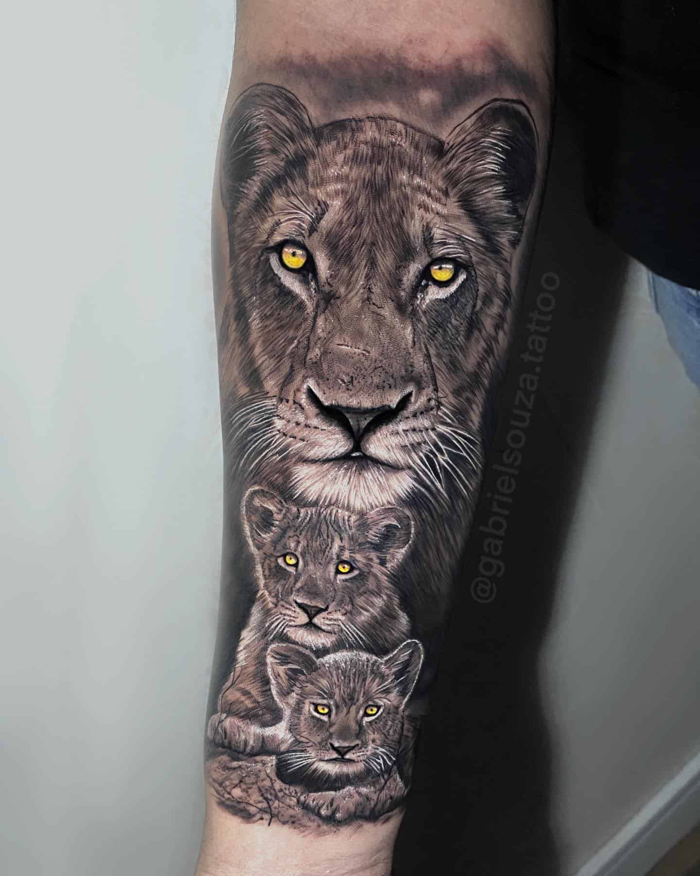 lion and cub tattoo on forearm