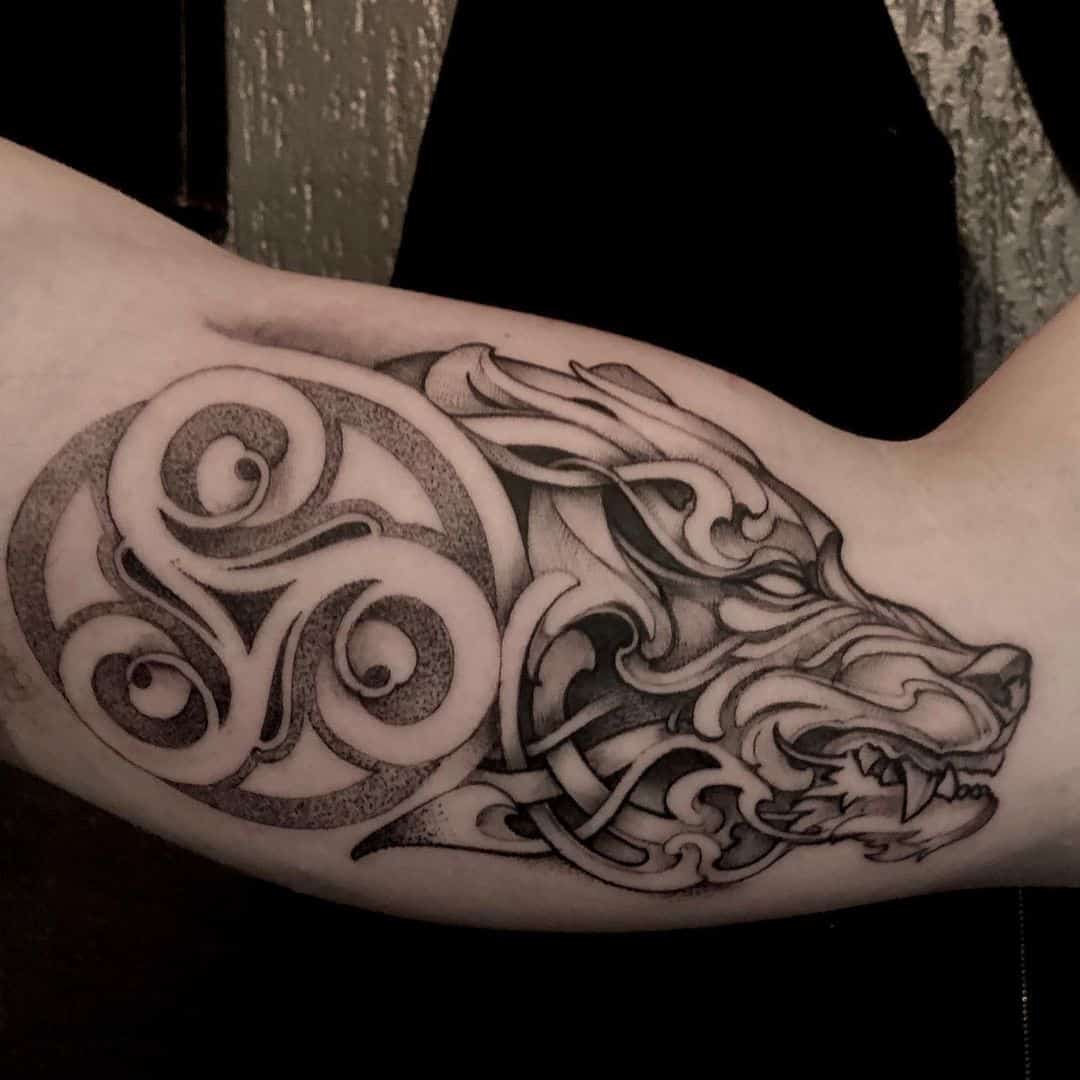 matierenoiretattoo celtic wolf tattoo on forearm