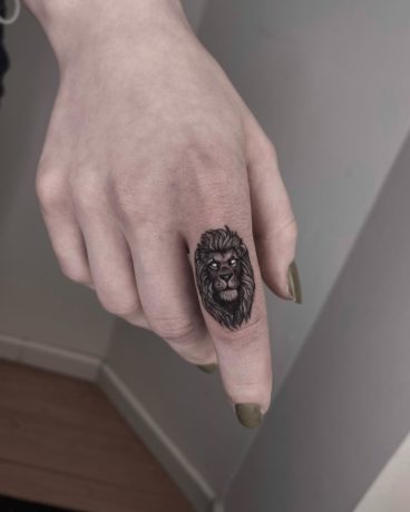 lion tattoo on finger