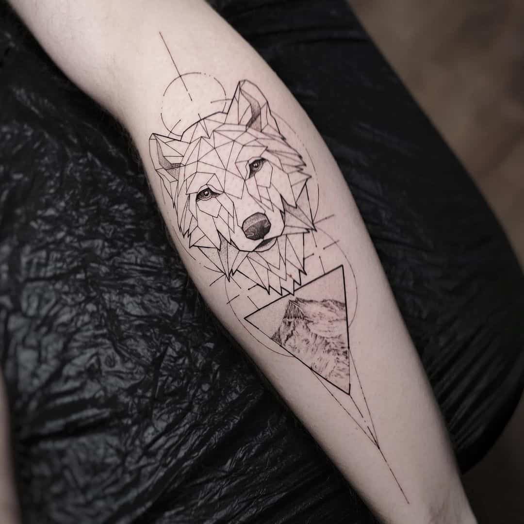 mitatink geometric pattern wolf tattoo on forearm