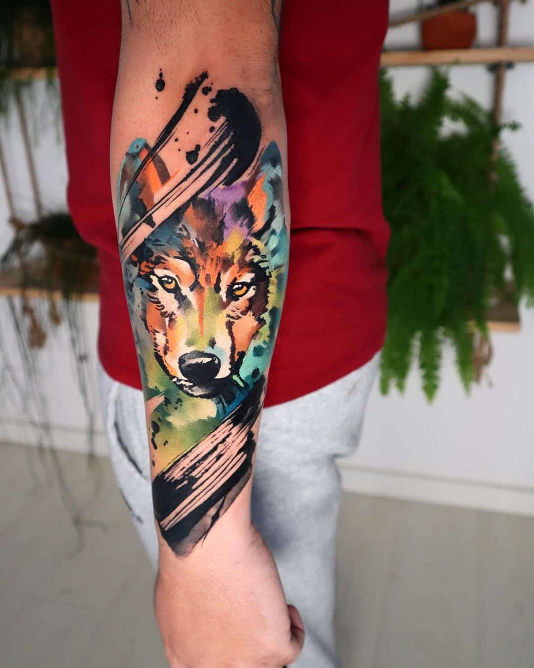 pablo ortiz wolf tattoo on forearm