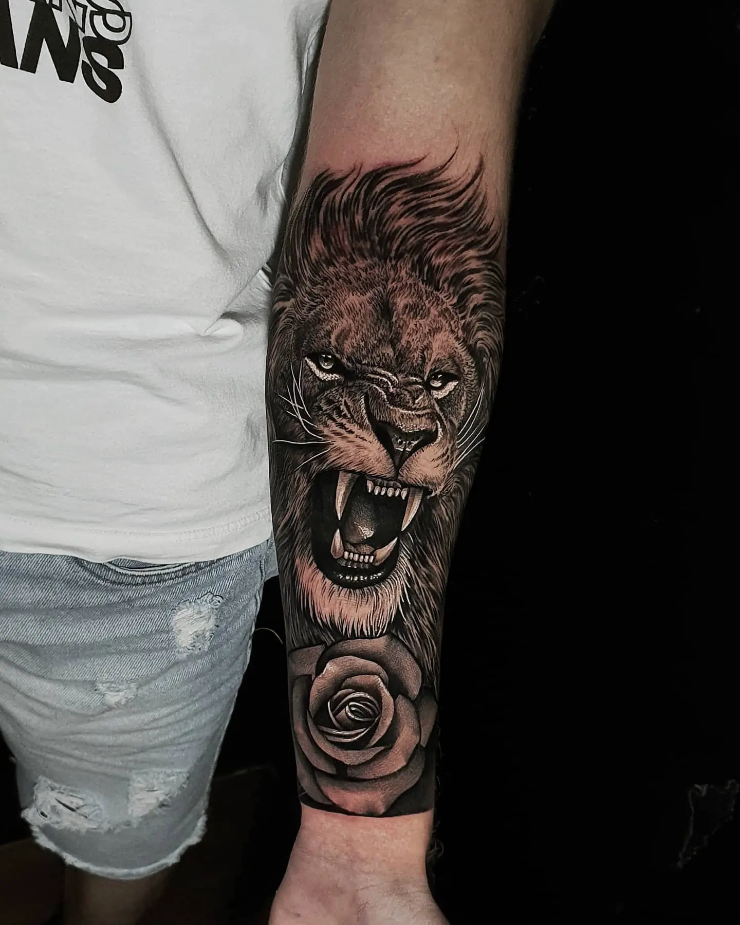 roaring lion tattoo in arm