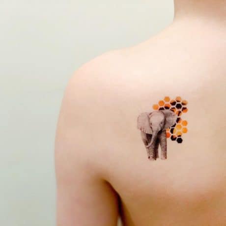 small elephant tattoo on back