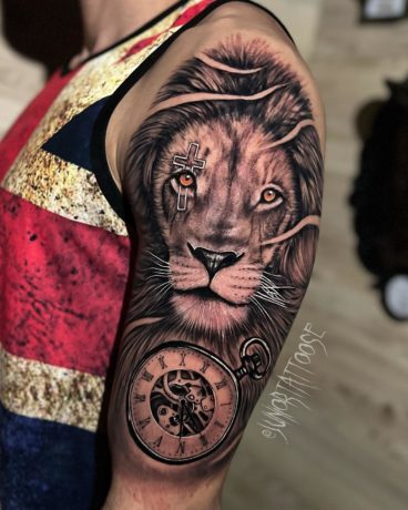 lion with cross tattoo