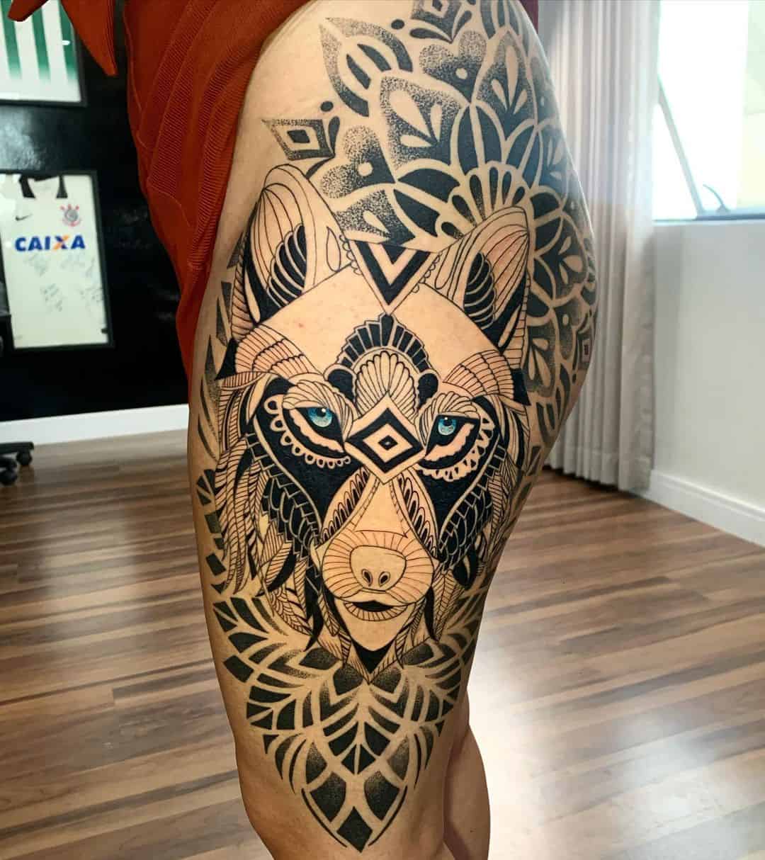 tribal style wolf tattoo on thigh by brunolopes.tattoo