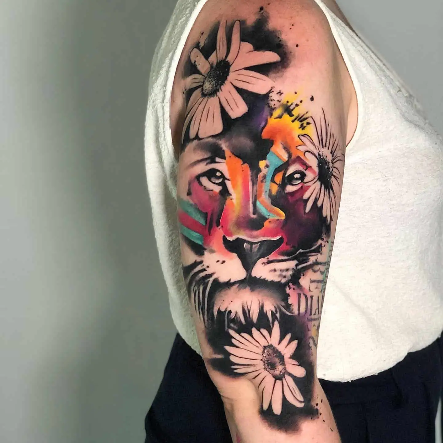 watercolor lion tattoo on arm