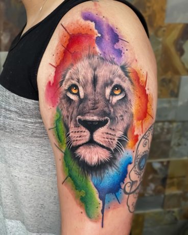 colorful watercolor lion tattoo