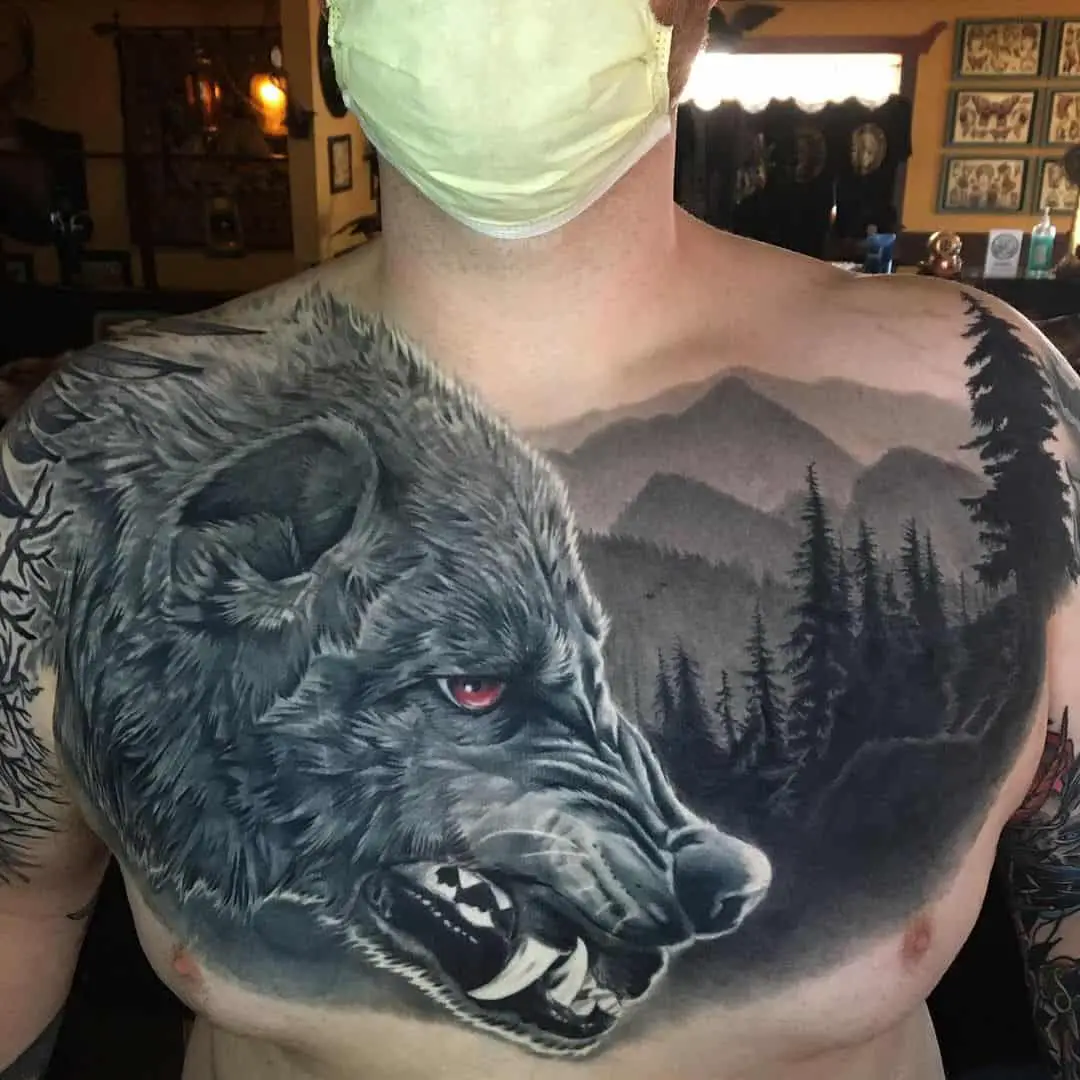 wolf black chest tattoo by aaronmckinneytattoo