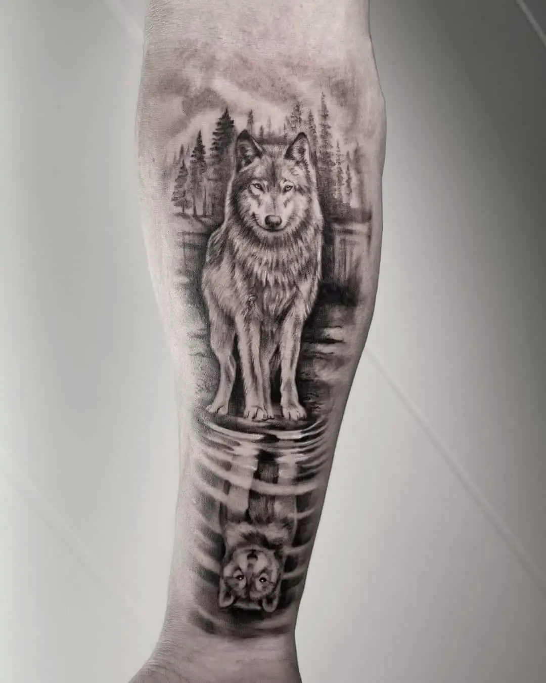 wolf in jungle tattoo on forearm