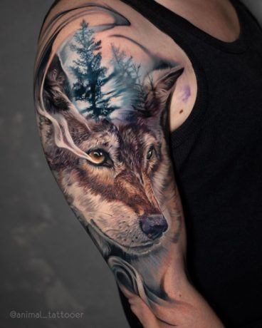 Wolf in wild tattoo on arm
