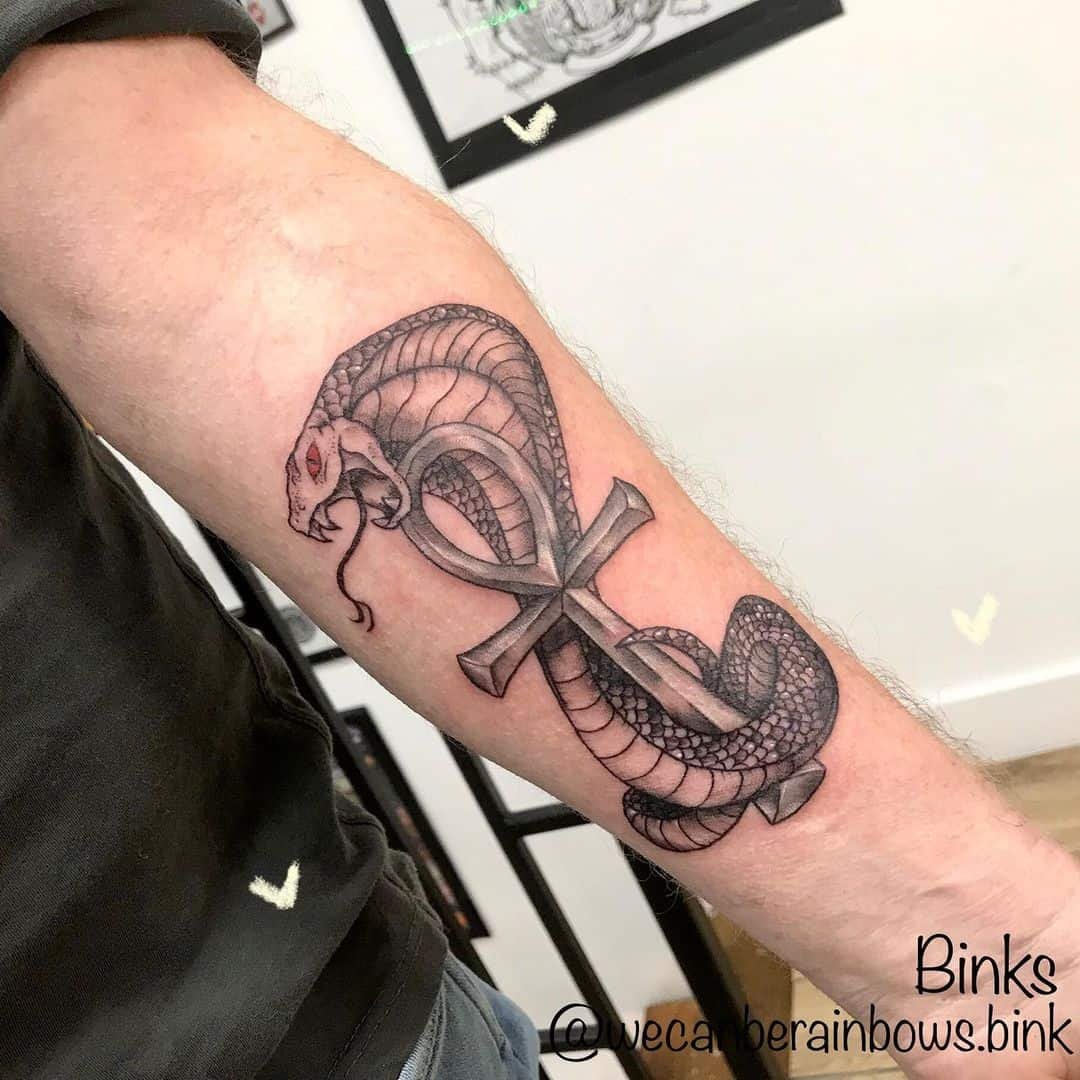 anrys snake tattoo on forearm