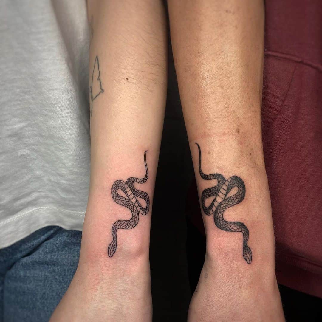couple snake tattoo on wrist