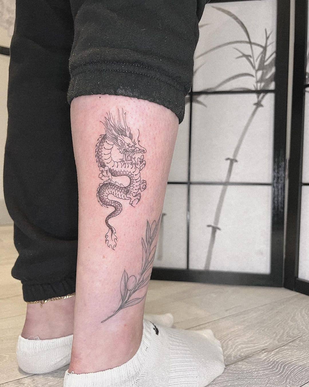 dragon tattoo by lucysaffrontattoo