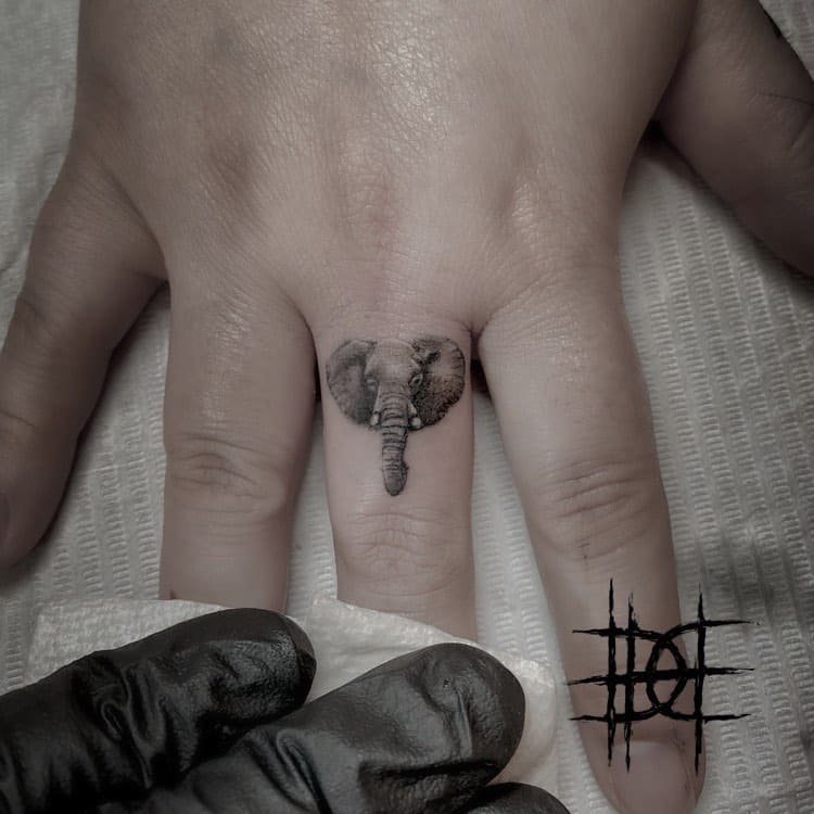 elephant tattoo on finger