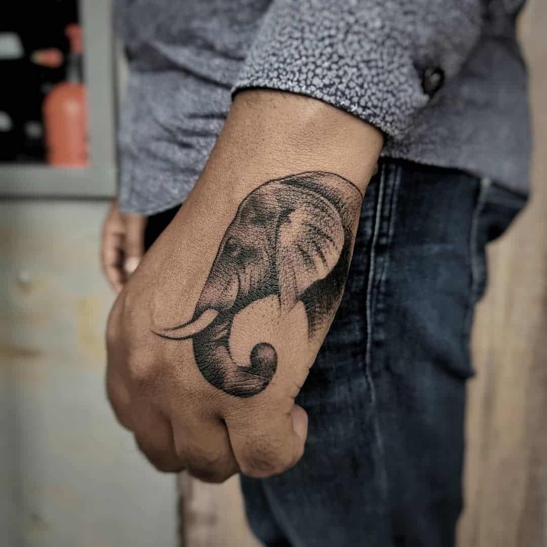 elephant tattoo on hand