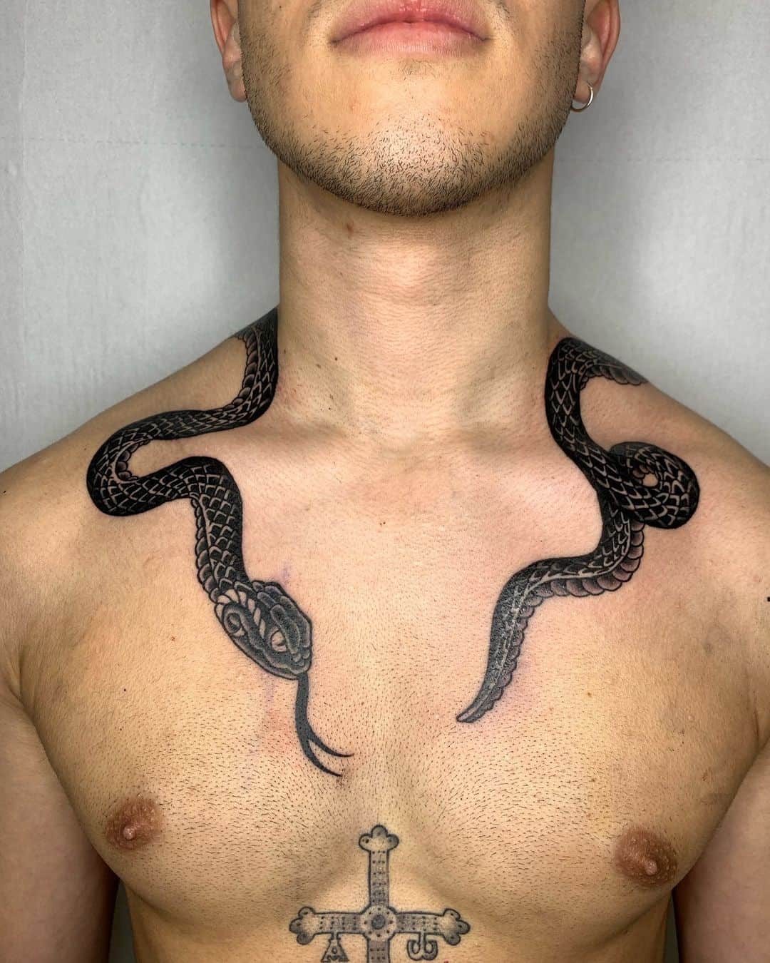 snake wrapped tattoo on neck 