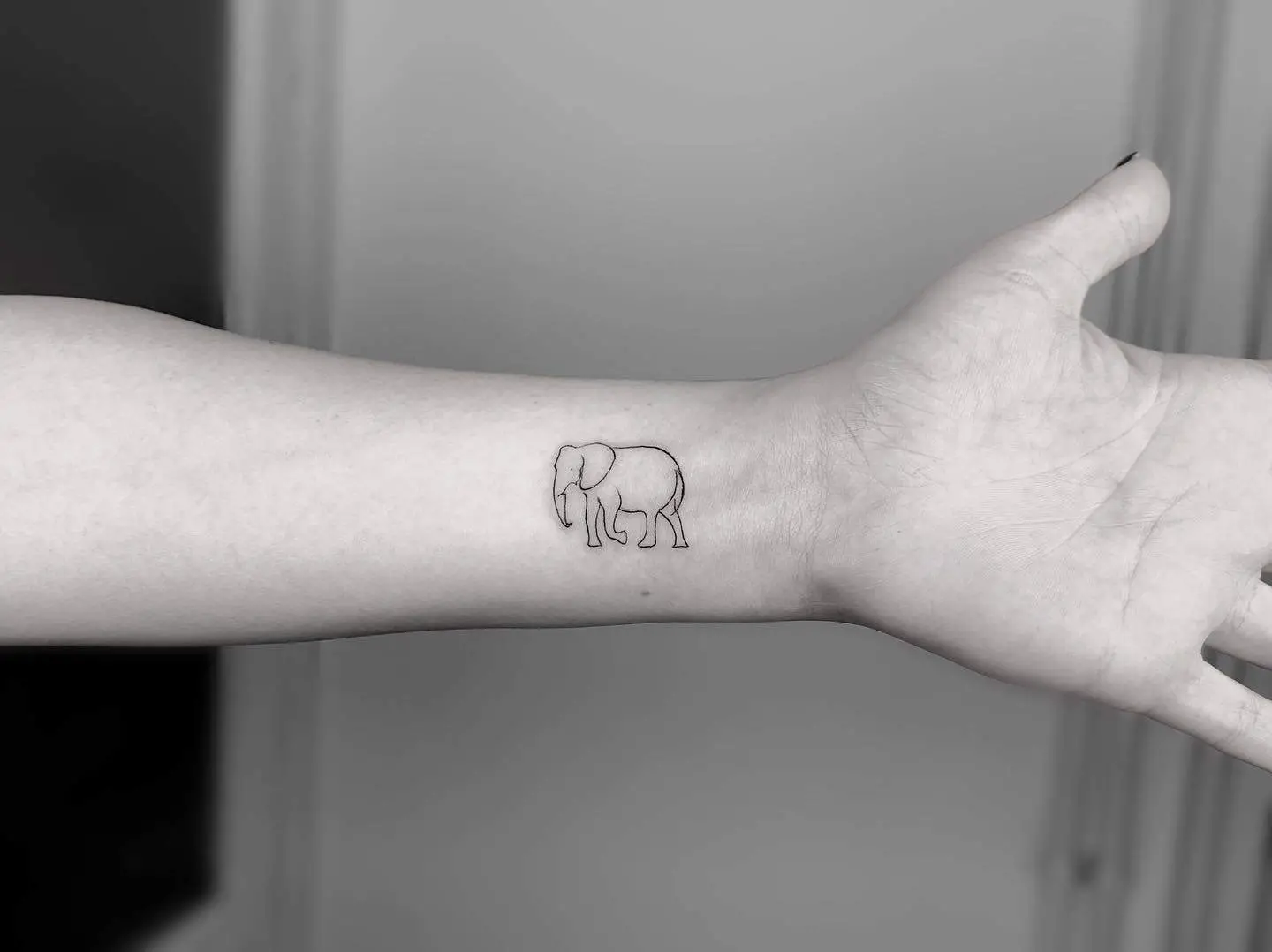minimalist elephant line tattoo
