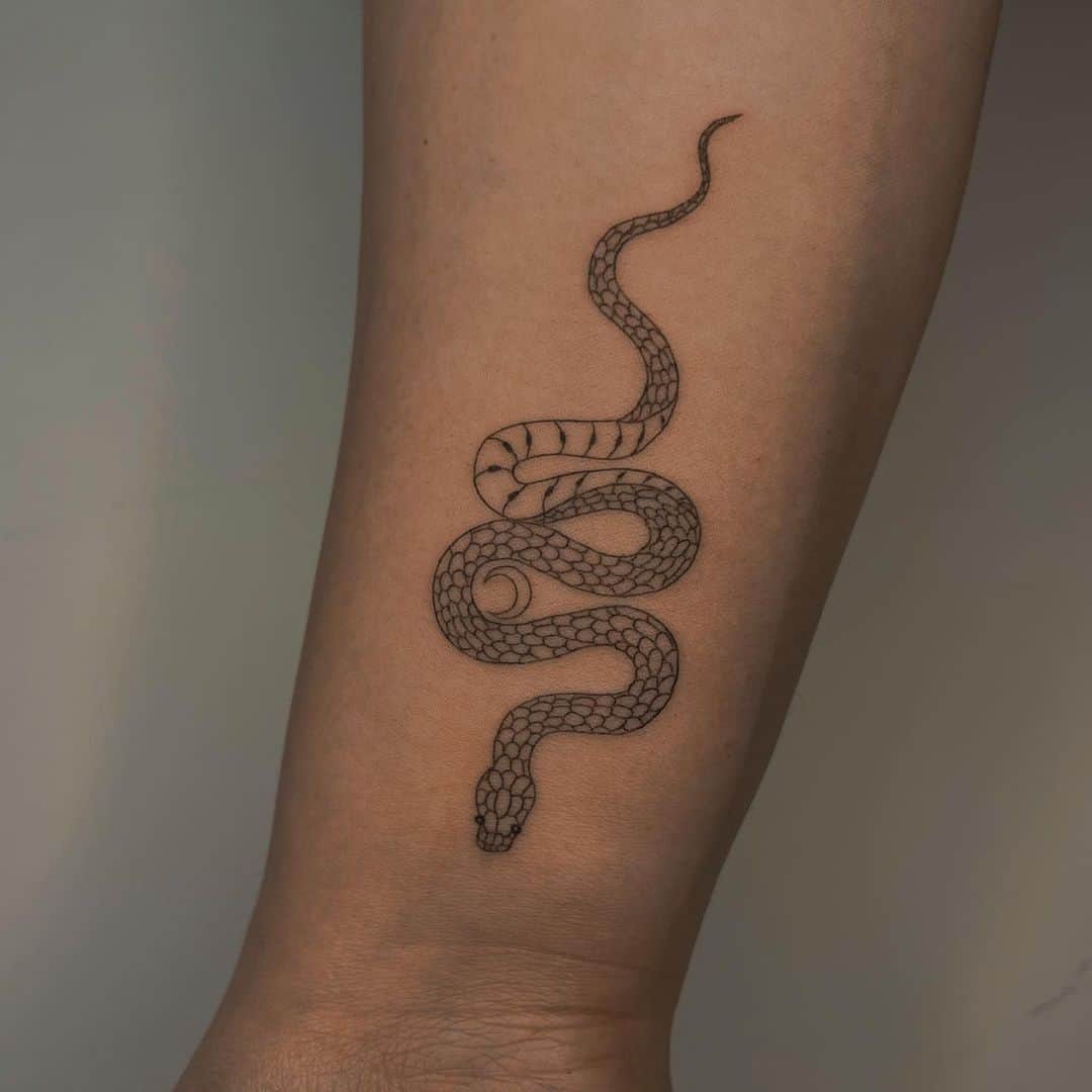 cute small snake tattoo