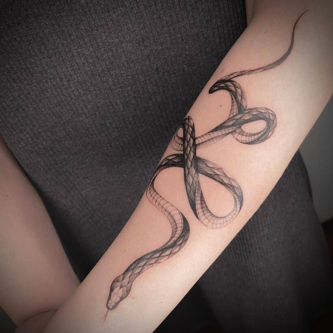 snake tattoo on forearm