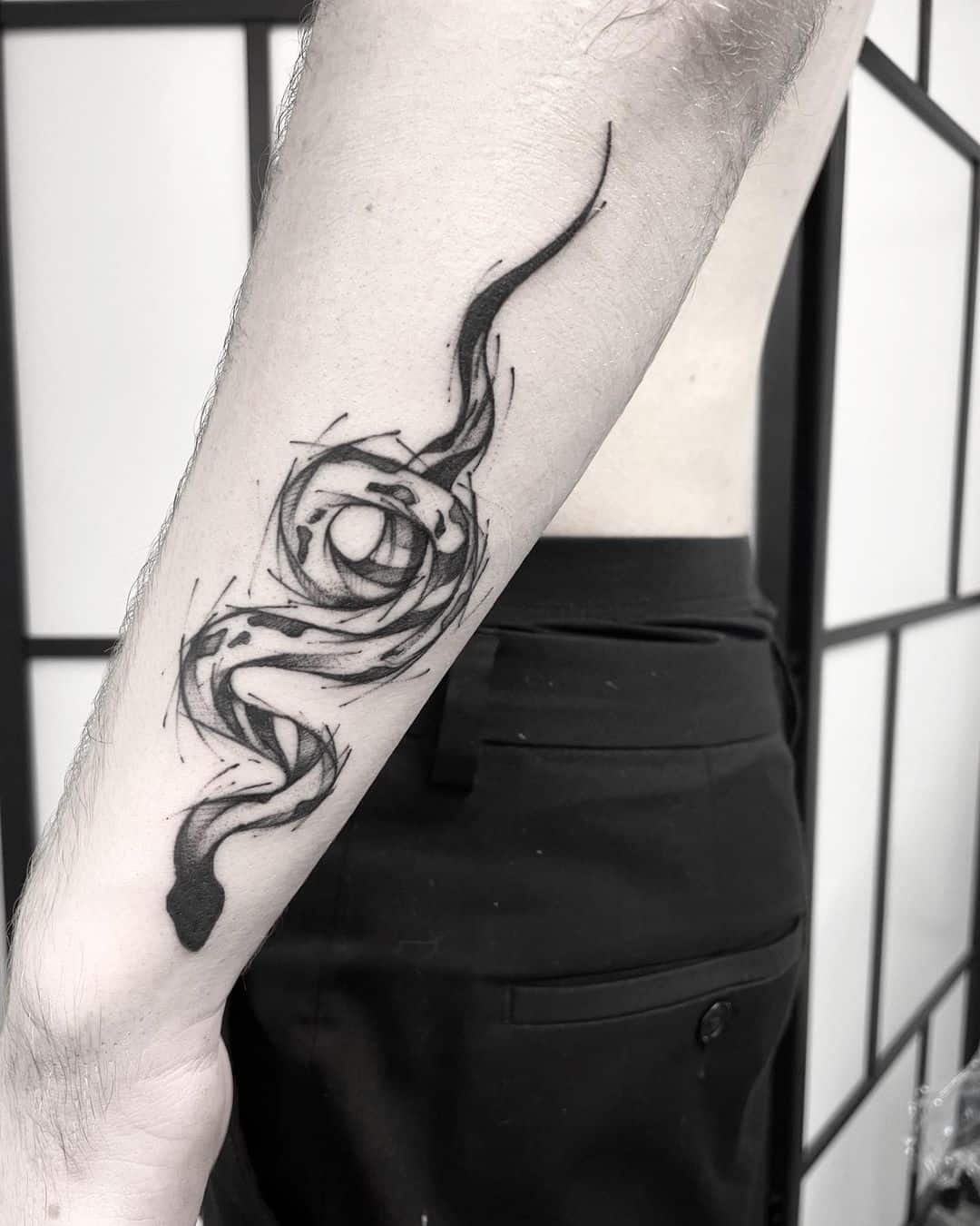 snake tattoo on forearm
